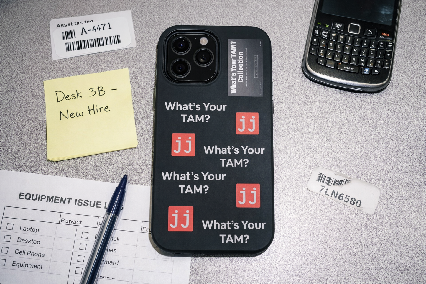Black iPhone Pro Max case featuring 'What's Your TAM?' text and red JJ logos in a corporate humor style.