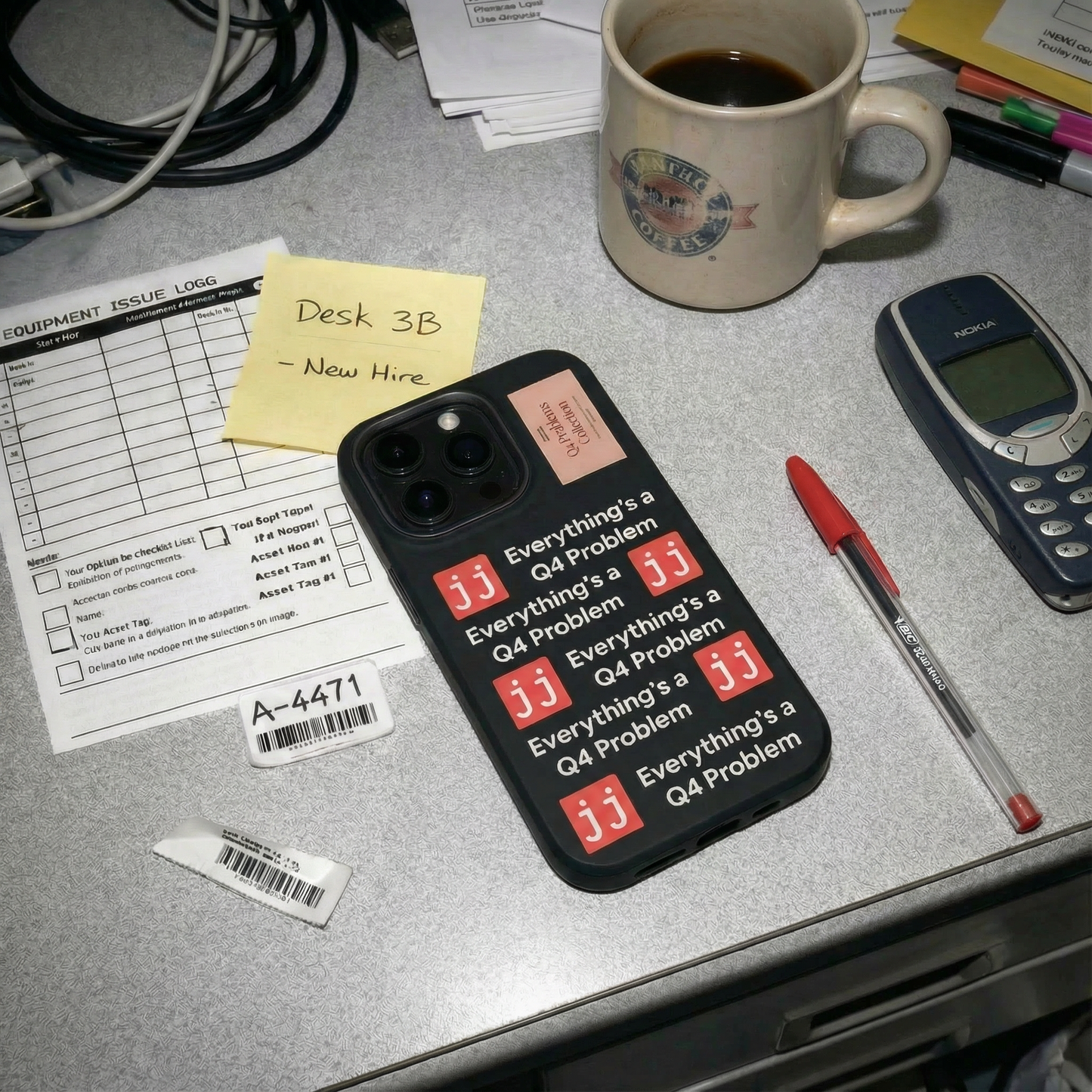 Everything’s a Q4 Problem' phone case on a desk with an equipment issue log, vintage BlackBerry, and New Hire note.