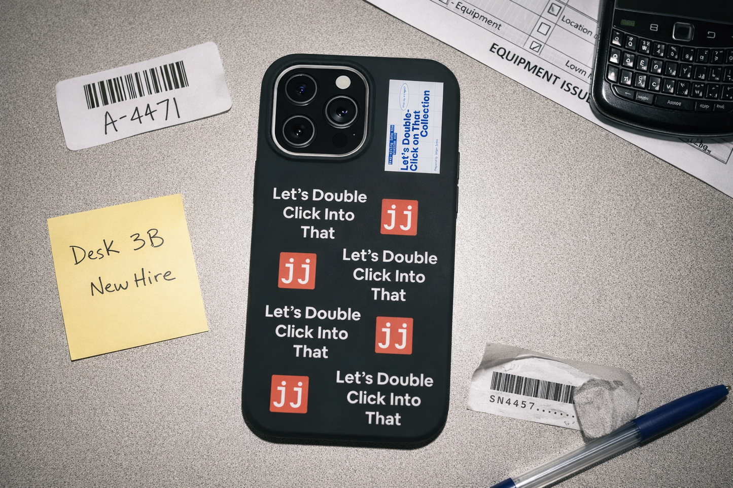 Jargon Junkie black iPhone 14 Pro Max case with Let's Double Click Into That text and JJ logos on office desk with equipment issue checklist corporate humor phone accessory