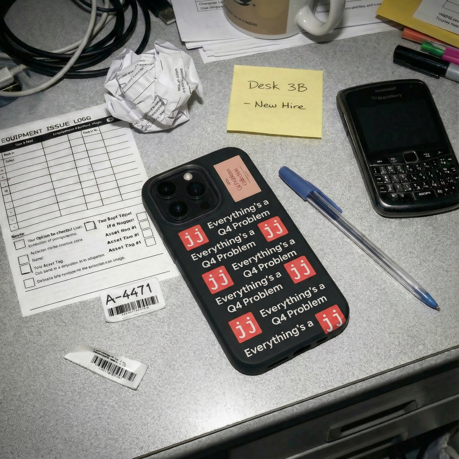 Everything’s a Q4 Problem' phone case on a desk with an equipment issue log, vintage BlackBerry, and New Hire note.
