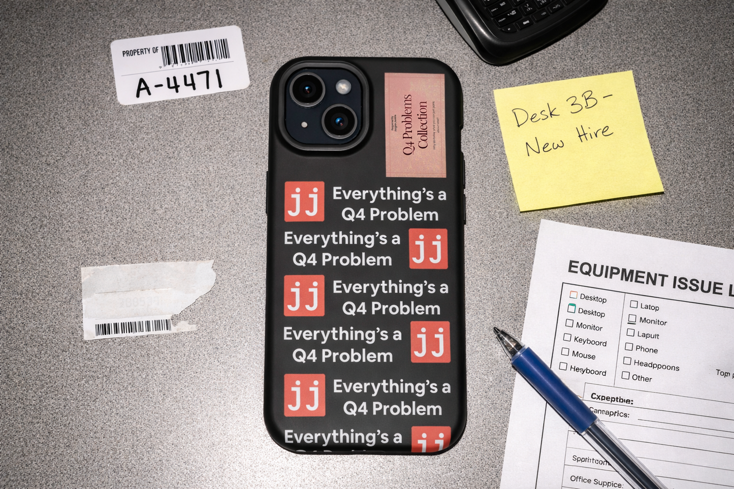 Everything’s a Q4 Problem' phone case on a desk with an equipment issue log, vintage BlackBerry, and New Hire note.