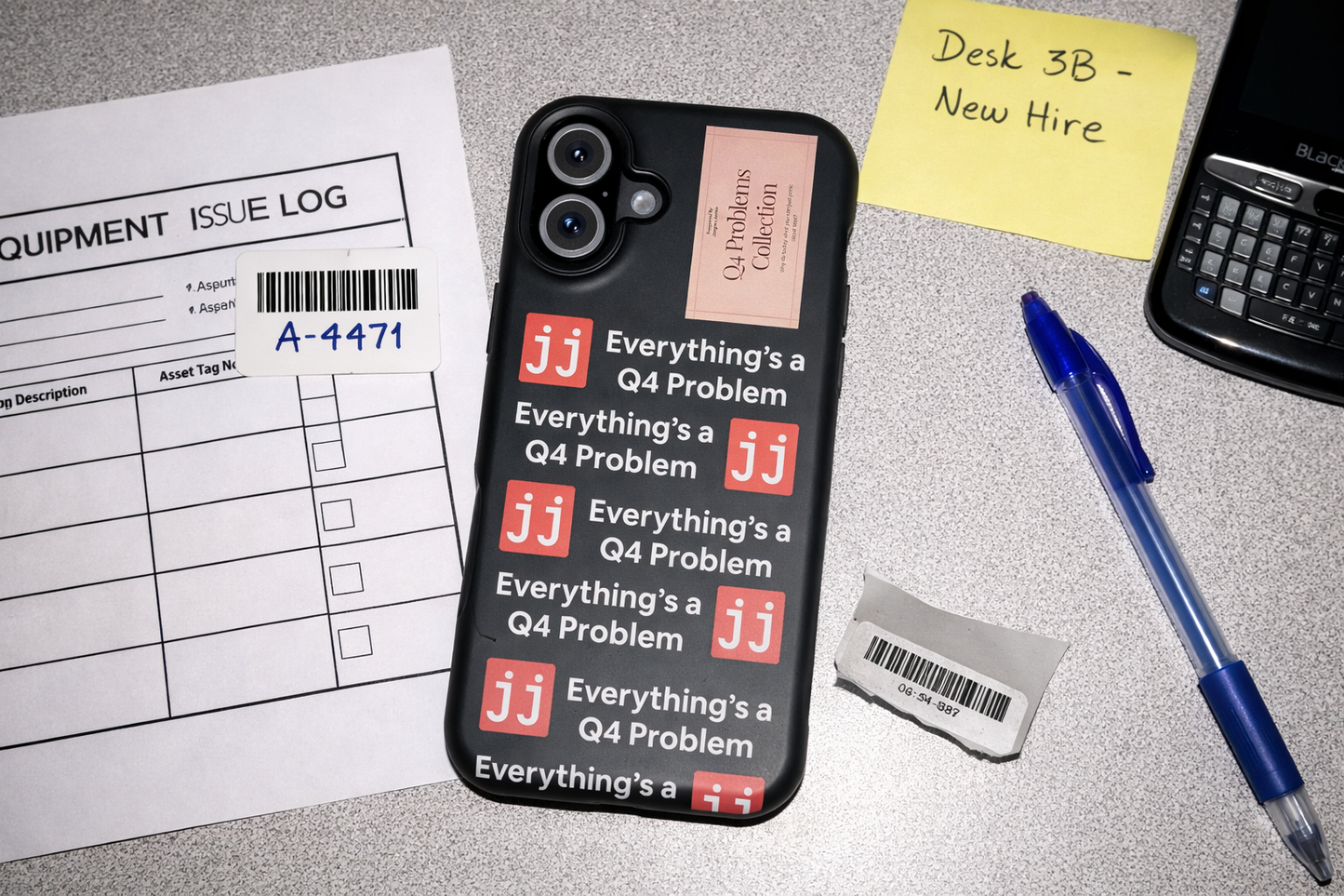 Everything’s a Q4 Problem' phone case on a desk with an equipment issue log, vintage BlackBerry, and New Hire note.