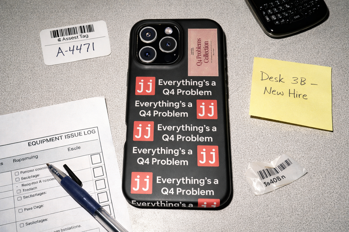 Everything’s a Q4 Problem' phone case on a desk with an equipment issue log, vintage BlackBerry, and New Hire note.