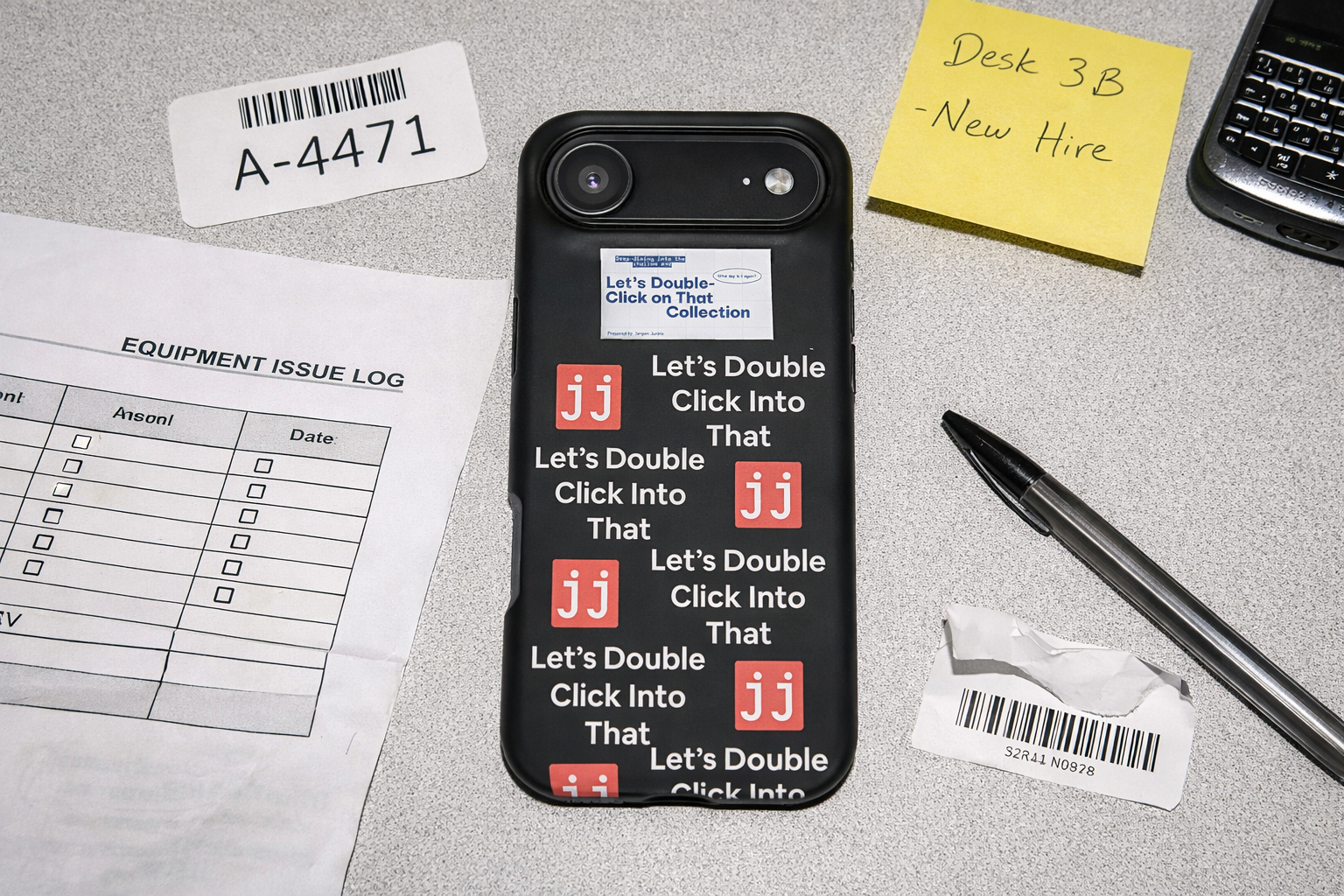 Jargon Junkie black iPhone 17 Air case with Let's Double Click Into That text and JJ logos on office desk with equipment issue log corporate humor phone accessory