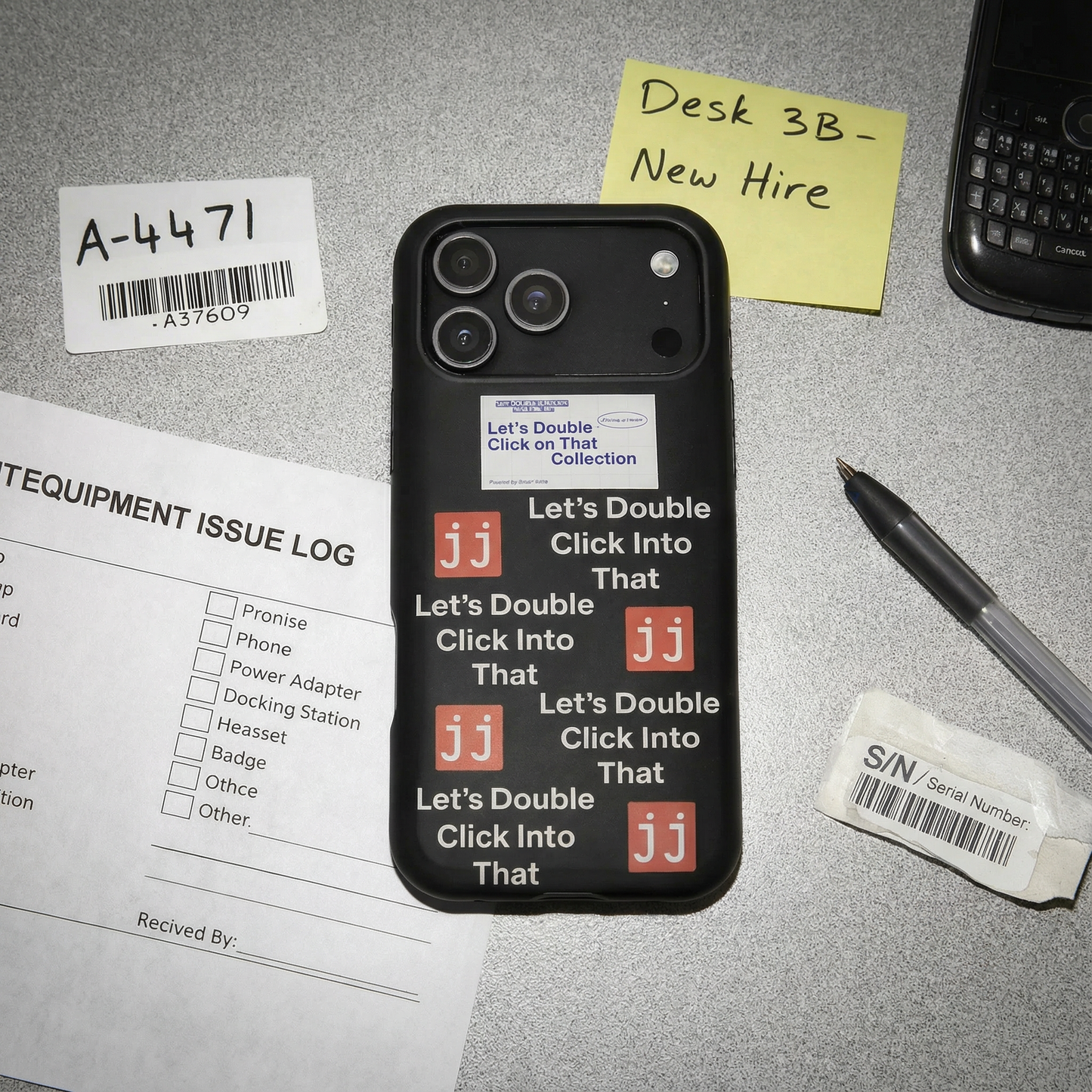 Jargon Junkie black iPhone 17 Pro Max case with Let's Double Click Into That text and JJ logos on office desk with IT equipment issue log corporate humor phone accessory