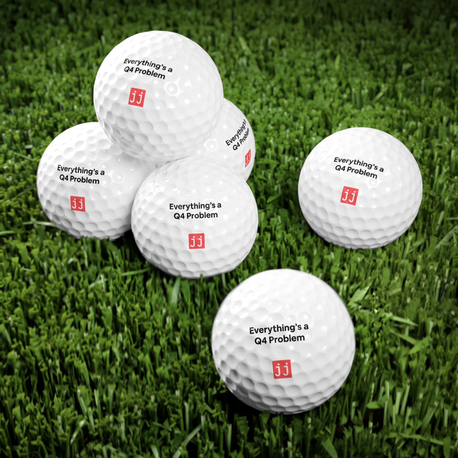 Jargon Junkie white golf ball with Everything's a Q4 Problem text office golf practice scene with Crush Q4 sales whiteboard corporate humor
