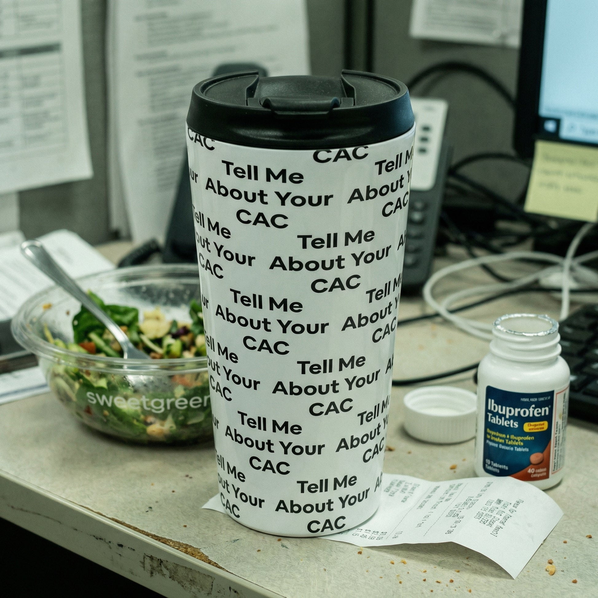 Jargon Junkie white tumbler with Tell Me About Your CAC text pattern on office desk lifestyle shot corporate humor drinkware
