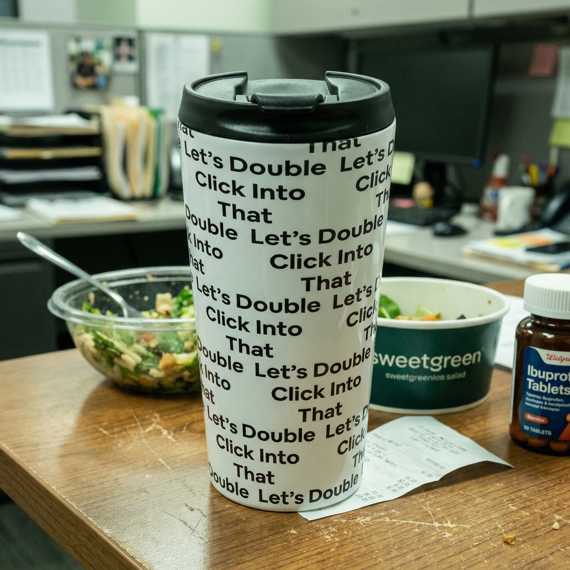 Jargon Junkie white tumbler with Let's Double Click Into That text pattern on office desk lifestyle shot corporate humor drinkware
