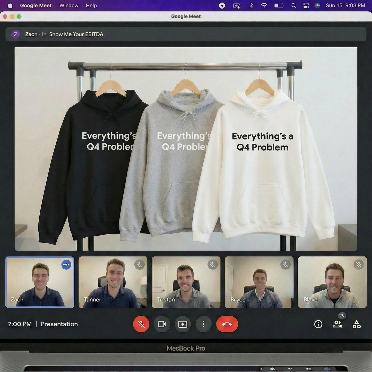 Jargon Junkie lifestyle display showing Q4 Problems hoodies in black gray and white on rack during video call corporate humor design