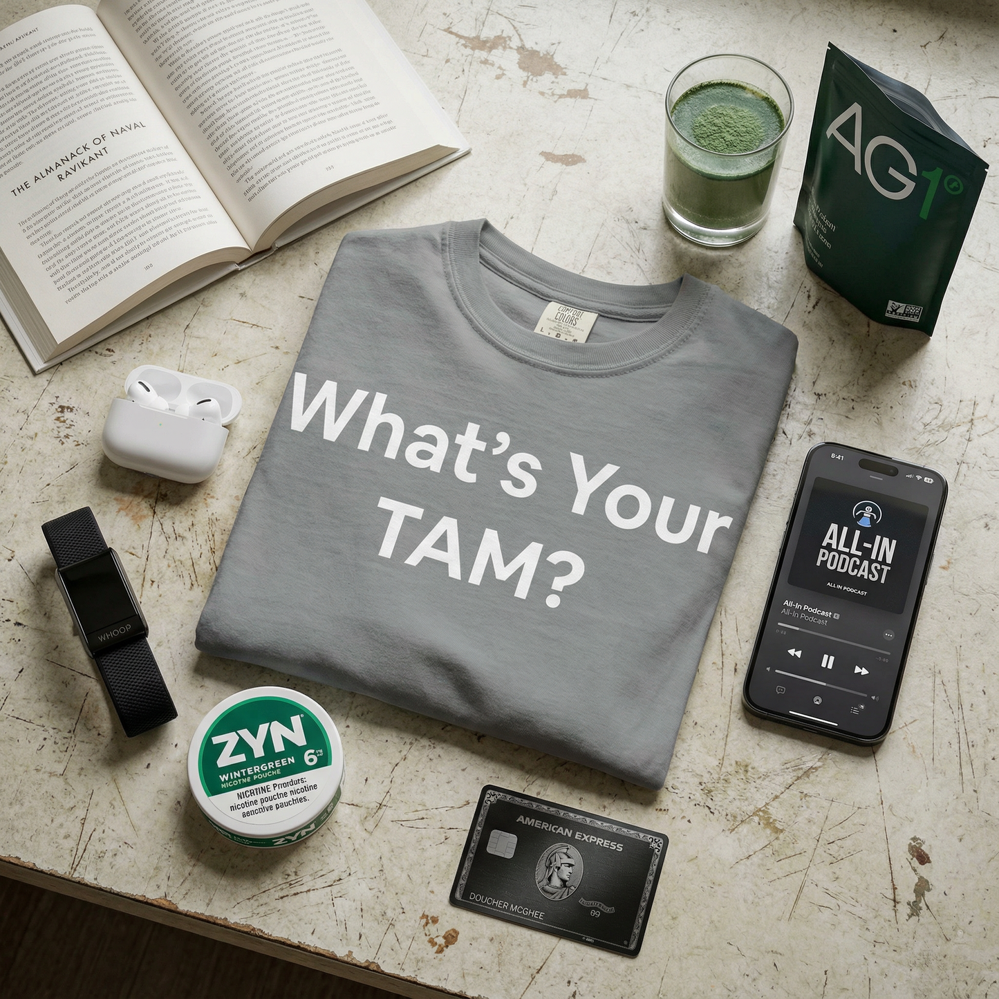 T-shirt with 'What's Your TAM' across the front in big bold text. Corporate humor for business people. 